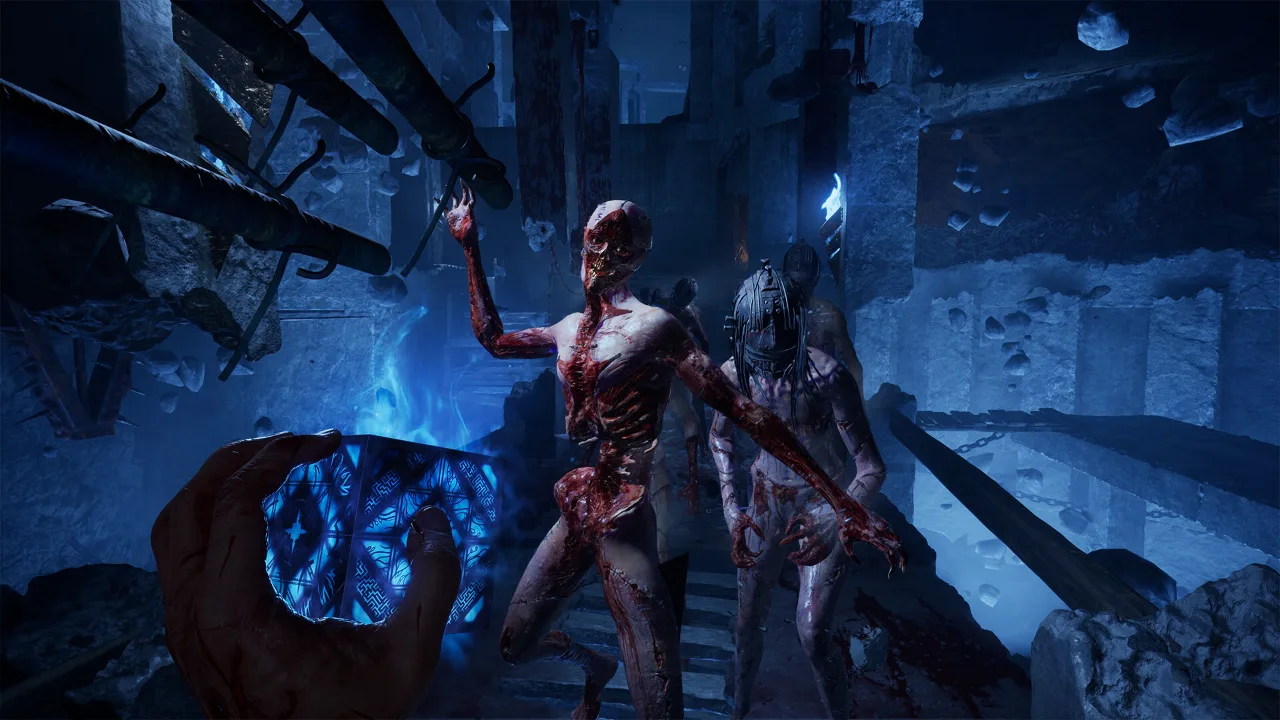 First-person view holding the glowing puzzle box as two bloodied enemies approach in a blue Labyrinth room in Hellraiser: Revival