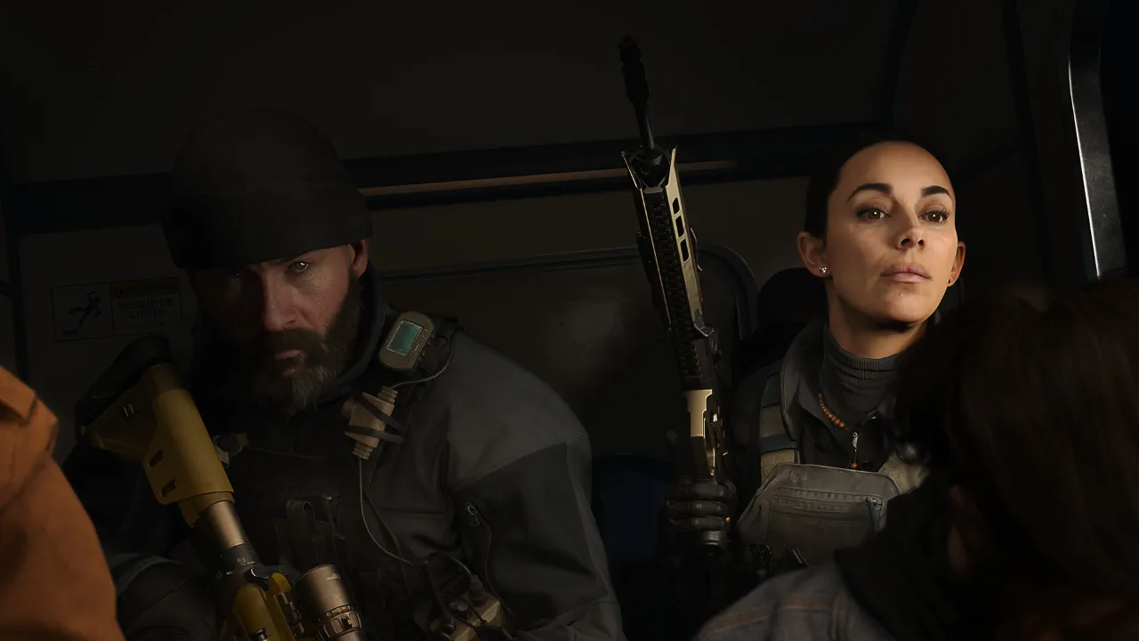 Two characters sitting in a dark vehicle in the Call of Duty: Modern Warfare 4 campaign
