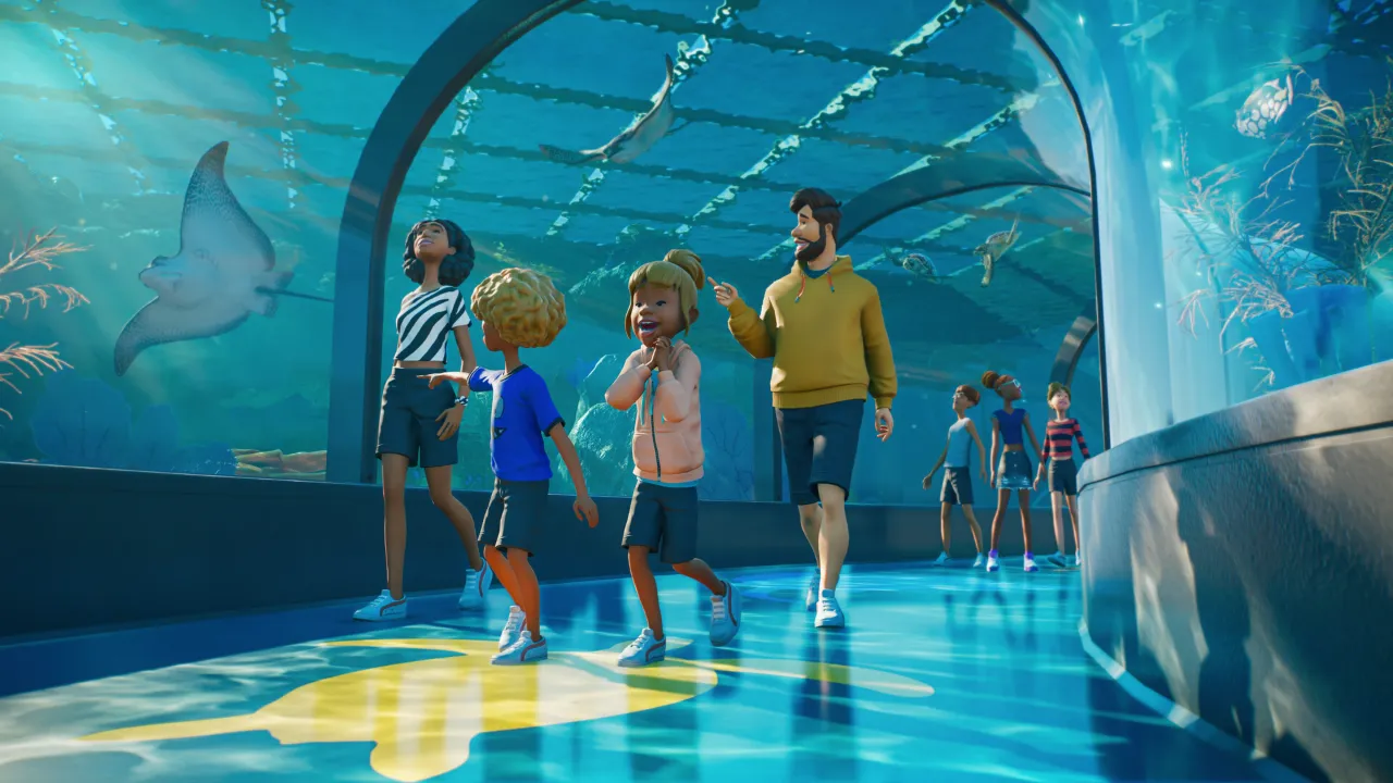 A family of guests walking through a glass aquarium tunnel with a manta ray swimming overhead