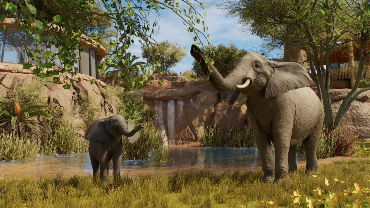 An elephant and her calf standing in shallow water in a Planet Zoo 2 habitat